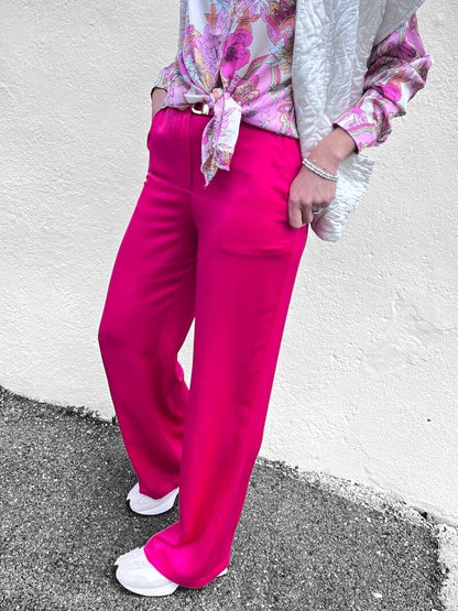 Pantalon satiné fuchsia côté